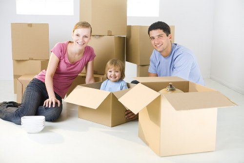 Professional furniture removals in Whitechapel with moving team loading a van