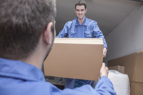 House removals team planning a move in Whitechapel street setting