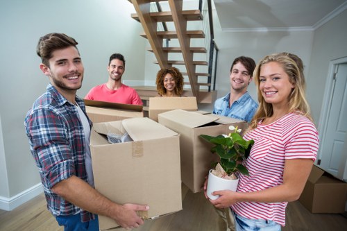 Professional flat removals planning in Whitechapel with moving boxes and apartment access