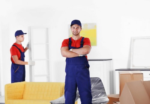 Man and van team loading furniture safely into a van