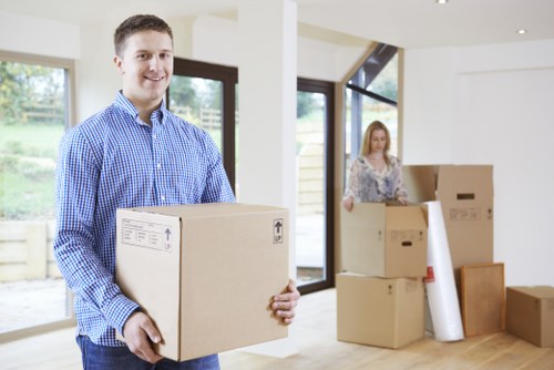 Moving crew handling boxes during a man and van service