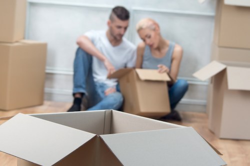 Packing boxes and furniture into a moving truck in Whitechapel