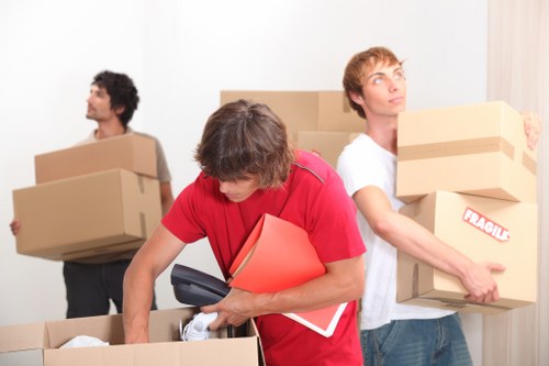 Worker checking items and route access before a move