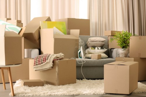 Professional movers handling desks and technology during an office move