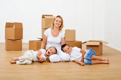 Packing and labeling office items before a move in East London
