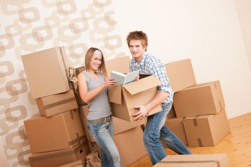 Packing fragile household items with protective materials in Whitechapel